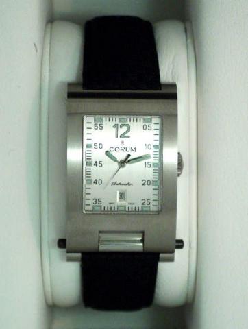 Corum, Tabogan, Ref. 145.161.20. Produced in the 1990's, sold on January 15, 2003..Fine and unusual, center-seconds, self-winding, water-resistant, asymmetric, rectangular curved, stainless steel gentleman's wristwatch with date and 40 hours autonomy, bea