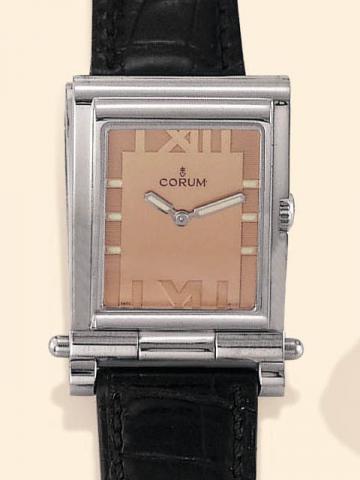 Corum, Tabogan, Ref. 56.151.20. Produced in the 1990's, sold on January 15, 2003.Fine and unusual, water-resistant, asymmetric, rectangular curved, stainless steel quartz gentleman's wristwatch bearing a sliding and hinged mechanism which transforms the w