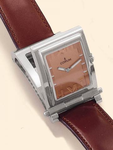 Corum, Tabogan, Ref. 64.151.20. Produced in the 1990's, sold on January 15, 2003.Fine and unusual, water-resistant, asymmetric, rectangular curved, stainless steel quartz gentleman's wristwatch bearing a sliding and hinged mechanism which transforms the w