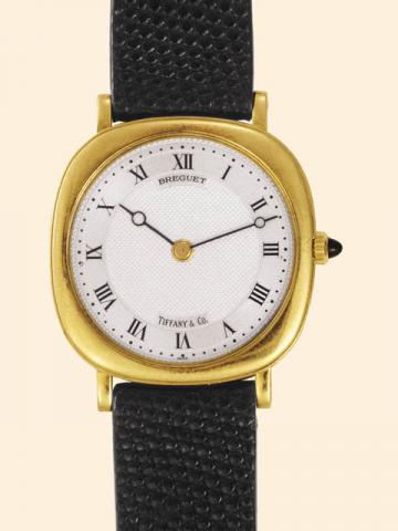 Breguet, Ref. 3560. Retailed by Tiffany Co. Produced in the 1980's.Very fine and elegant, cushion shaped, thin, 18K yellow gold gentleman's wristwatch with an 18K yellow gold Breguet buckle.