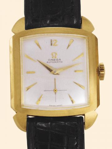 Omega, No. 12853600, caseNo. 11121300, Ref. 3950. Produced circa 1951.Fine, self-winding, carr_ galb_, 18K yellow gold gentleman's wristwatch with a yellow gold plated Omega buckle.