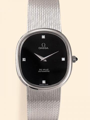 Omega, Ref. 213. Produced in the 1970's.Fine and elegant, oval, thin, self-winding, 18K white gold and diamonds gentleman's wristwatch with an integrated and linen-textured Omega bracelet and clasp.