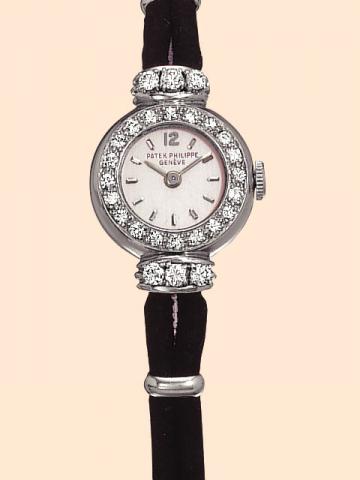 Patek Philippe Cie, Geneve, No. 945327, case No. 513493, Ref. 3152. Produced circa 1951. Very fine, platinum and diamond lady's wristwatch with cord bracelet, platinum rings and clasp.