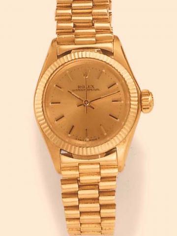 Rolex, Oyster Perpetual, Ref. 6618. Produced in the early 1960's.Fine, center-seconds, self-winding, water-resistant, 18K yellow gold lady's wristwatch with an 18K yellow gold President-type bracelet.