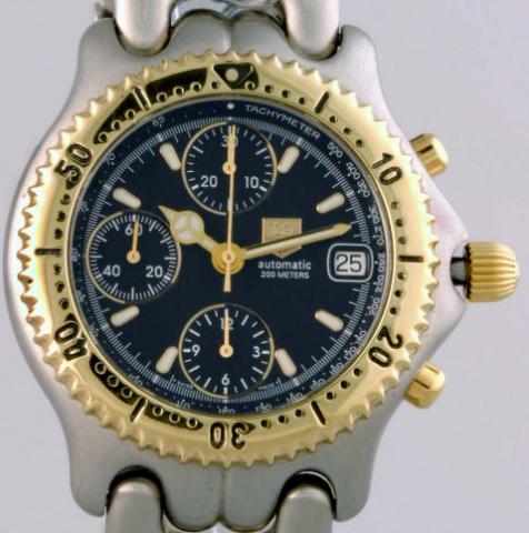 TAG Heuer, Link Chronograph. Produced in the 1990's.Fine, self-winding, water-resistant, stainless steel and yellow gold gentleman's wristwatch with round button chronograph, registers, tachometer, date and a stainless steel and yellow gold TAG Heuer link