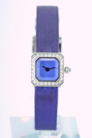 Corum, Ref. 137.433.69. Produced in the 1990 's, sold on January 15, 2003.Very fine and unusual, small, octagonal, thick, 18K white gold and diamond lady's quartz wristwatch with an 18K white gold Corum buckle. Accompanied by a fitted box and certificate.