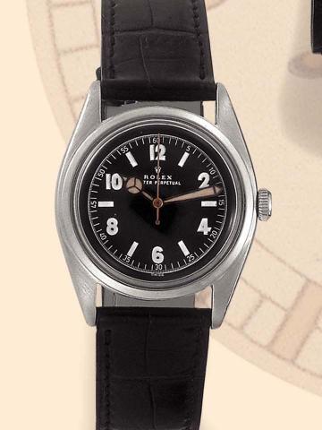 Rolex, Oyster Perpetual, Ref. 4392. Produced in the 1940's. Fine, tonneau-shaped, center-seconds, self-winding, water-resistant, stainless steel gentleman's wristwatch.