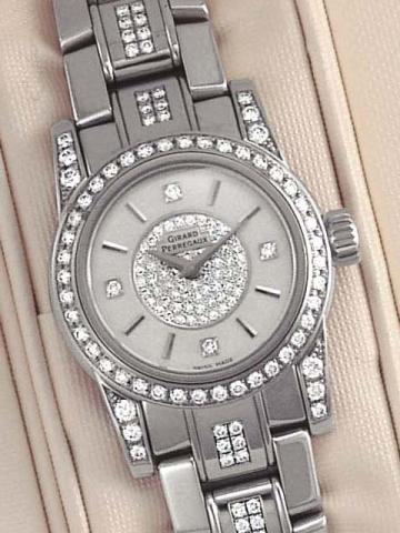 Girard-Perregaux, Lady F, Automatic,Ref. 8038. Produced circa 2000.Fine, self-winding, water-resistant, stainless steeland diamond lady's wristwatch with a stainlesssteel Girard-Perregaux link bracelet and deployant clasp. Accompa-niedby a fitted box and 