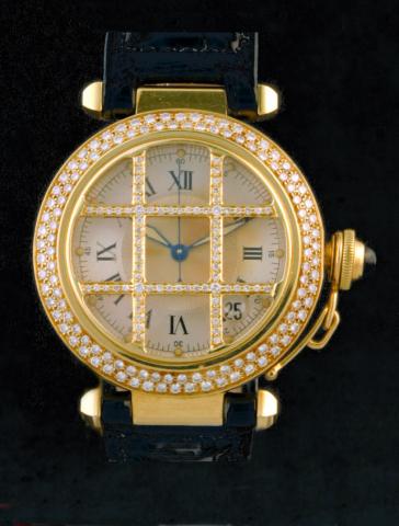 Cartier, Pasha Grille, Ref. 1028. Produced in the 1990s.Very fine, center-seconds, self-winding, water-resistant to 100 m/330 ft, 18K yellow gold and diamonds gentleman's wristwatch with date and an 18K yellow gold Cartier deployant clasp.