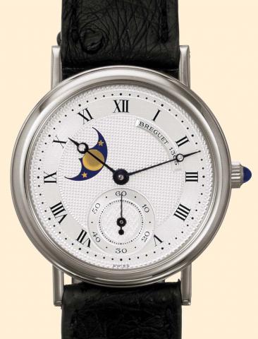 Breguet, No. 4496, Ref. 3280. Produced in the 1990s. Fine, astronomic, 18K white gold mid-size wristwatch with moon phases and an 18K white gold buckle. Accompanied by a fitted box.