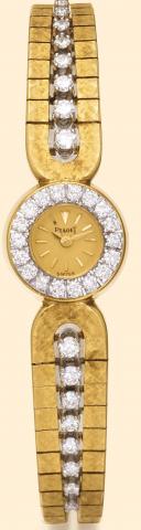 Piaget Geneve, No. 612592, case No. 76464, Ref. 3452. Manufactured in 1961. Very fine, 18K yellow gold and diamond lady's wristwatch with an 18K yellow gold guilloch_ bracelet set with 8 graduated round diamonds on each side.