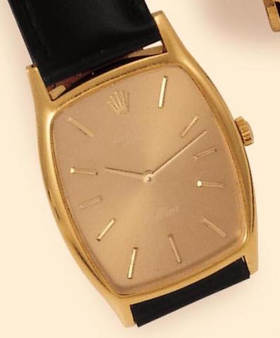 Rolex Cellini, Ref. 3807. Produced in the 1970s. Fine, tonneau-shaped, 18K yellow gold gentleman