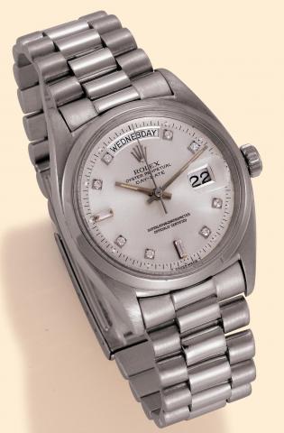 Rolex, Oyster Perpetual Day Date, Superlative Chronometer, Officially Certified, Ref. 6613. Produced in the late 1950s. Very fine, tonneau-shaped, center-seconds, self-winding, water-resistant, platinum and diamonds gentleman's wristwatch with day and dat
