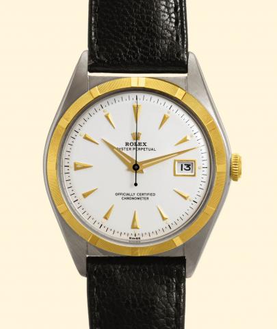 Rolex Oyster ster Perpetual, Official ly Certified Chronometer, Ref. 5031. Produced in the 1950s. Fine and rare, tonneau-shaped, center-seconds, self-winding, water-resistant, yellow gold and stain- less steel gentleman's wristwatch with date and a gold p