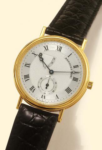 Breguet, No. 805, Ref. 3380. Produced circa 2000. Very fine, 18K yellow gold gentleman's wristwatch with power-reserve and an 18K yellow gold Breguet buckle.
