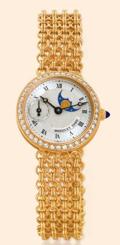 Breguet, Ref. 1989. Made in the 1990s. Very fine, astronomic 18K yellow gold and diamond-set lady's self-winding wristwatch with phases of the moon and an integral 18K yellow gold four-strand chain mail Breguet bracelet. Accompanied by a fitted box and ce