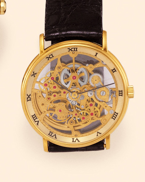 International Watch Co., Schaffhausen, Portofino, Automatic, Ref. 2701. Produced in the 1990s. Very fine and elegant, thin, skeletonized, self-winding, 18K yellow gold gentleman's wristwatch with an 18K yellow gold IWC buckle. Accompanied by a fitted box 