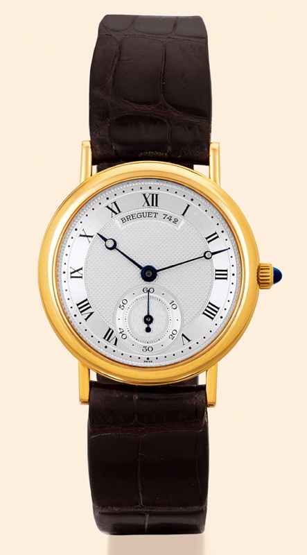 Breguet, No. 742. Made in the 1980s. Very fine, thin, 18K yellow gold mid-sized gentleman's wristwatch with an 18K yellow gold Breguet buckle. Accompanied by a box and certificate.
