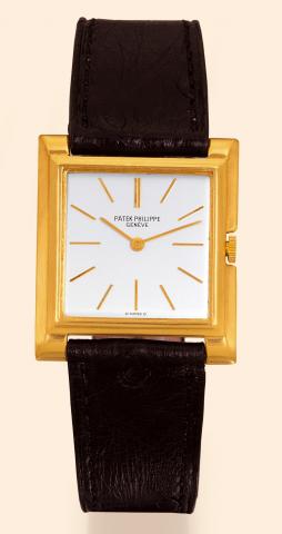 Carr_ Extra-Plat.Patek Philippe Cie, Geneve, No. 855696.case No. 689874, Ref. 2562. Produced.circa 1955..Very fine and unusual, thin, square, 18K yellow gold gentleman's.wristwatch with an 18K yellow gold Patek Philippe.buckle.