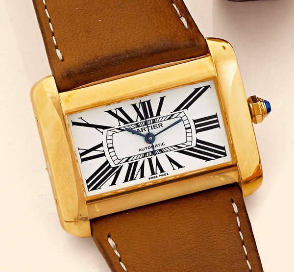 Tank Divan.Cartier, Tank Divan, Automatic, Ref. 2603. Production of this model started in 2002..Fine and unusual, horizontal rectangular and curved, center-seconds, self-winding, water-resistant, 18K.yellow gold gentleman's wristwatch with an 18K yellow g