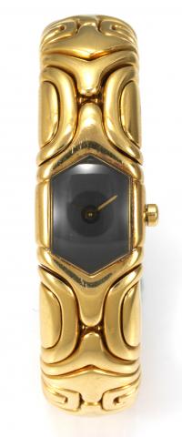 Yellow Gold Alveare.Bulgari, Ref. BJ 02 - G 347. Made in the 1990s..Fine, 18K yellow gold lady`s quartz wristwatch with an integrated, 18K yellow gold Bulgari flexible bangle bracelet with geometrical design.