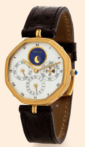 G_rald Genta, Ref. 2840.7. Made in the.1980s..Very fine, octagonal, astronomic, selfwinding.18K yellow gold gentleman's wristwatch with.perpetual calendar, moon phases and an 18K yellow gold.G_rald Genta buckle. Accompanied by a fitted box, certificate.an