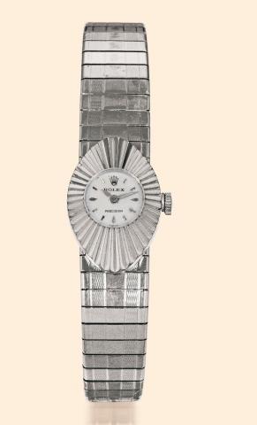 Ref. 2000 Cam_l_on.Rolex, Precision, Cam_l_on, Ref. 2000. Made.in the 1960s..Fine and unusual, oval, 18K white gold lady's wristwatch.with an 18K white gold sliding strap.