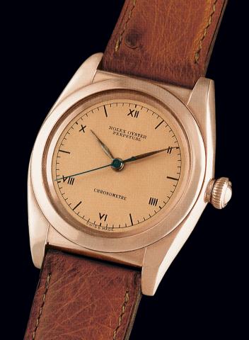 Ref. 3696, So-Called Tropical.Rolex, Oyster Perpetual, Officially Certified Chronometer, Ref..3696. Case No. 489101. Made in 1946..Fine and unusual, tonneau-shaped, center seconds, self-winding, 9K pink gold.and stainless steel gentleman's wristwatch with