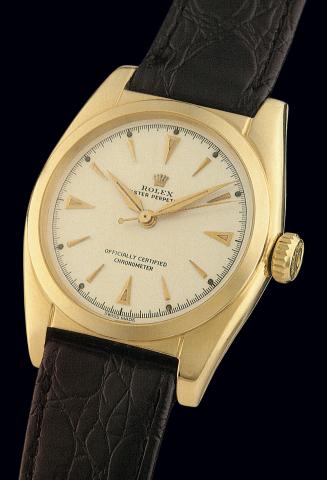 Ref. 6050.So-Called Bubble-Back.Rolex, Oyster Perpetual, Officially.Certified, Chronometer, with Super-.Oyster winding crown, Ref. 6050. Case No. 704326..Made in 1950..Fine and rare, tonneau-shaped, center seconds, selfwinding.18K yellow gold gentleman's 