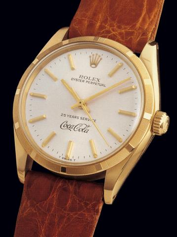 Ref. 1003 COCA-COLA.Rolex, Oyster Perpetual, 25 Years service, Coca-Cola.Ref. 1003/1005. Case No. 5426177. Made In 1977..Very rare, fine and interesting, water-resistant, center seconds, self-winding.tonneau-shaped, 18K yellow gold gentleman's wristwatch 