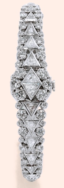 White Gold.and Diamonds.Rolex, Precision.Ref. 9099. Made in the 1950s..Fine, 18K white gold lady's wristwatch.set with 56 round brilliant cut.diamonds, total weight approx. 3.50.ct., 14 triangular-shaped diamonds.total weight approx. 4.00 ct, with.conceal