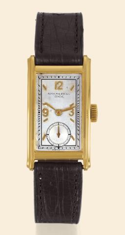 Yellow Gold.Ref. 417.Patek Philippe Co..Geneve, No. 832269, case No. 505229.Ref. 417. Made in 1938, sold on July 7.1938..Fine, rectangular, curved, 18K yellow.gold gentleman's wristwatch. Accompanied.by the Extract from the Archives.