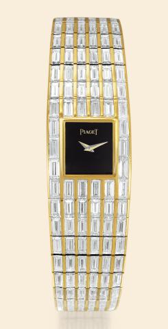 Piaget, case No. 502975, Ref. 15312. Made in the 1990s..Extremely fine, elegant and important 18K yellow gold lady's wristwatch.with an 18K yellow gold articulated bracelet set with 316.baguette diamonds weighing 41.9 cts.