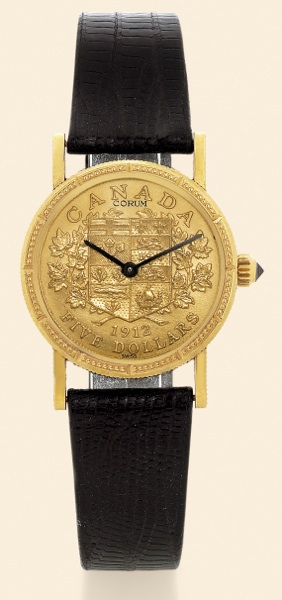 Corum, Coin Watch.No. 173724.case No. 335660, Ref..55.300.56. Made in the 1990s..Fine, 18K yellow gold lady's wristwatch.inserted in a $5 Canadian gold.coin dated 1912, with a Corum buckle..Accompanied by a fitted box and certificate..To be sold without r