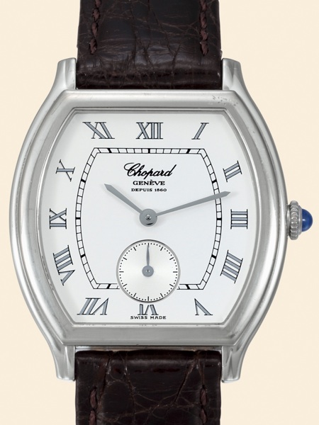 Chopard Tonneau.Ref. 2246. Made in.the 1990s..Fine, tonneau-shaped, water-resistant.18K white gold gentleman's wristwatch.with an 18K white gold Chopard.buckle.