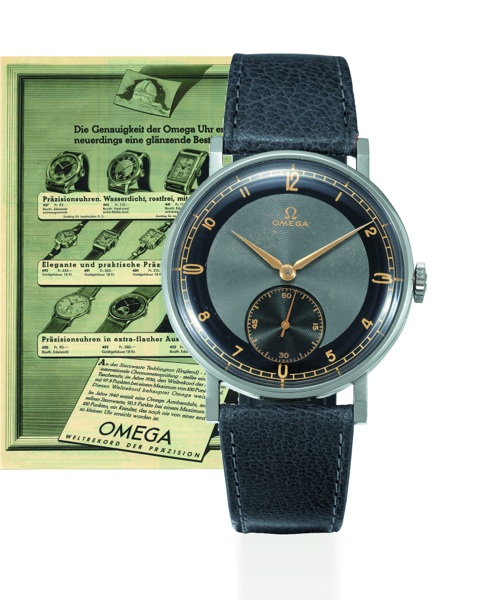 BLACK AND GRAY DIAL CHRONOMETER.Omega, No. 9178460, case No. 10031056, Ref. CK 2186. Sold on March 31, 1941..Very fine and rare, oversized, Staybrite gentleman`s wrist chronometer with stainless steel.Omega buckle. This watch is sold with a box, Certifica