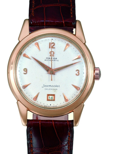 SEAMASTER CALENDAR Omega, Seamaster, Automatic, Calendar, No. 12527686, case No. 11082116, Ref..OT 2627. Sold in 1953..Fine, center seconds, self-winding, water-resistant, 18K pink gold gentleman`s wristwatch.with a cream honeycomb dial, date and an 18K p