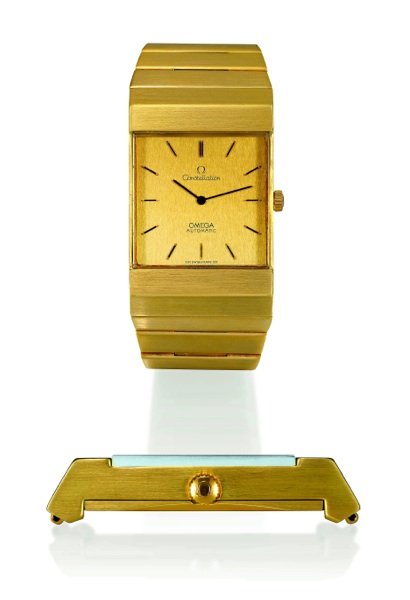 SO-CALLED INGOT Omega, Constellation, Automatic, No. 35912539, Ref. BA 351.8359. Sold on.November 23, 1976..Fine and rare, rectangular, self-winding, 18K yellow gold gentleman`s wristwatch.with topaze-colored crystal and an integral 18K tapered gold ingot