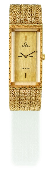 DE VILLE EMERAUDE Omega, No. 33419900, case No. A079, Ref. BA 8262. Sold on November 15, 1972..Fine and elegant, rectangular, 18K yellow gold lady`s wristwatch with an integral.woven 18K yellow gold Omega bracelet and clasp. This watch is sold with a box.