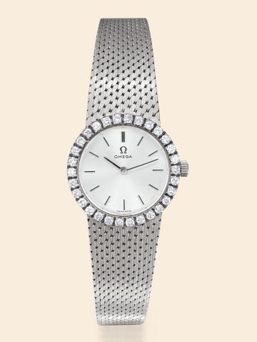 White Gold and Diamonds.Omega, No. 25737973, Ref. 7198. Made in 1967..Fine and elegant, diamond-set 18K white gold.and lady's wristwatch with an 18K white gold integral.textured bracelet.