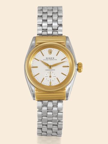 Ref. 3595, Steel and Gold Rigid Hooded.Rolex, Oyster Perpetual Chronometre.Ref. 3595, case No. 46074. Made in 1946..Very fine and rare, tonneau-shaped, self-winding, waterresistant.stainless steel and yellow gold gentleman's wristwatch.with reeded yellow 