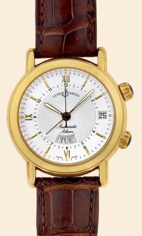 San Marco Alarm.Ulysse Nardin, Le Locle, San Marco.Alarm, Ref. 601-77. Made in the.1990s..Fine, center seconds, self-winding, water-resistant, 18K.yellow gold wristwatch with day, date, alarm feature.and an 18K yellow gold Ulysse Nardin buckle..Accompanie