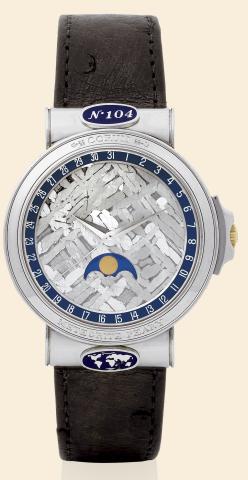 Corum, Meteorite Peary, No. 104.Ref. 71.450.70. Made in the 1990s..Very fine, rare and interesting, self-winding.water-resistant, platinum wristwatch with meteorite dial.date and moon phases and a stainless steel Corum buckle.