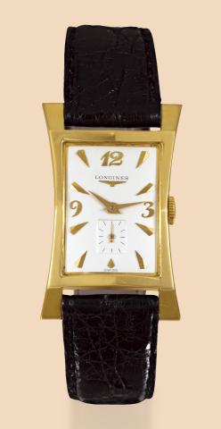 Longines, Ref. 2038-2, case No. 2233704. Made in the 1940s..Fine and rare, rectangular curved and flared, 14K yellow gold wristwatch with a gold-plated Longines buckle..Accompanied by the original fitted box.To be sold without reserve