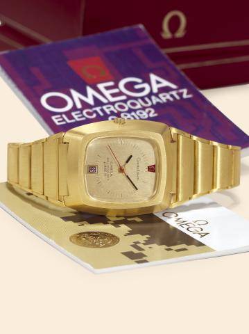 Constellation, Electroquartz, f8192 Hz.Omega, Constellation, Electroquartz, f8192 Hz, Ref. 196.005. Made in 1974..Fine and very rare, rectangular, pupitre, water-resistant, 18K yellow gold, asymmetric.wristwatch with red date and an 18K yellow gold Omega 
