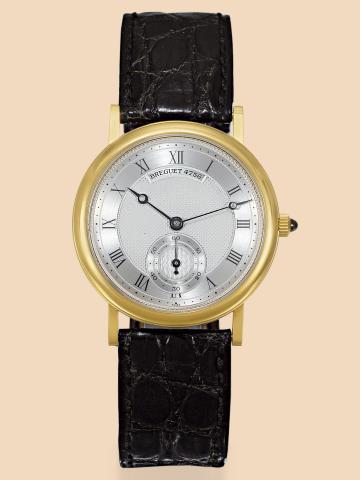 Classic Dress.Breguet, No. 4756, Ref..4756B. Made in the 1990s..Fine, thin, 18K yellow gold wristwatch.with an 18K yellow gold Breguet.buckle. Accompanied by a fitted box.and booklet.