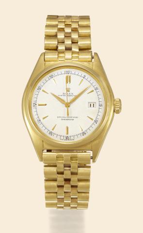 Ref. 5030, Red Black Date.Rolex, Oyster Perpetual, Officially Certified.Chronometer, Ref. 5030, case No..658577. Made in 1949..Fine and very rare, tonneau-shaped, centre-seconds, selfwinding.water-resistant, 18K yellow gold wristwatch with.date and an 1