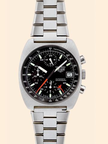 Carrera.Heuer, Carrera - Chronograph.Automatic, Ref. 11001..Made circa 1980..Fine, tonneau-shaped, self-winding.water-resistant, stainless steel wristwatch.with round button chronograph, registers.tachometer, date and a stainless steel Heuer.link bracelet
