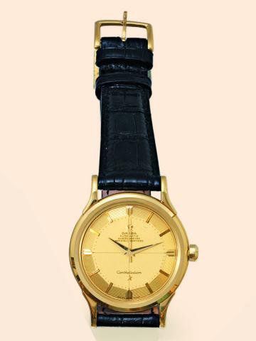 Omega, Constellation, Chronometer, Officially Certified, movement No. 14225844, case No. 11380754.Ref. 2782. Made in 1954..Fine, center seconds, self-winding, water-resistant, 18K yellow gold wristwatch with a yellow gold Omega buckle.