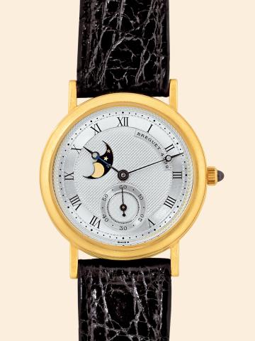 Moon Phases.Breguet, Moon Phases, No. 4299..Made in the 1990s..Very fine, astronomic, 18K yellow gold mid-size wristwatch.with moon phases and an 18K yellow gold.Breguet buckle.